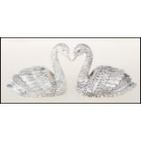 A pair of 925 silver plate salt and pepper table condiments in the form of finely detailed swans