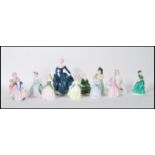 A collection of eleven Royal Doulton ceramic figurines to include Cissie HN 1809 First Recital HN