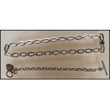 A silver hallmarked link bracelet having a heart pendant with a T-bar clasp. Together with a