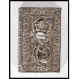 An early 20th Century Chinese silver filigree calling card case in the form of a book having applied