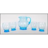 A vintage mid 20th Century 1950's blue glass lemonade set consisting of pitcher jug and four glasses