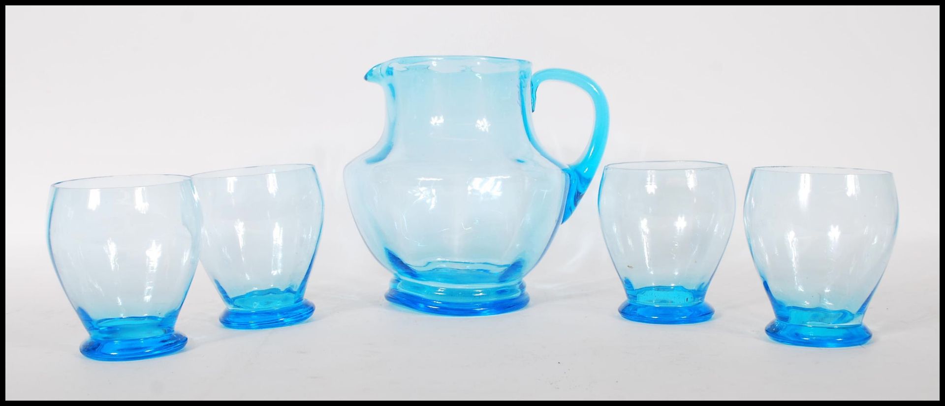 A vintage mid 20th Century 1950's blue glass lemonade set consisting of pitcher jug and four glasses