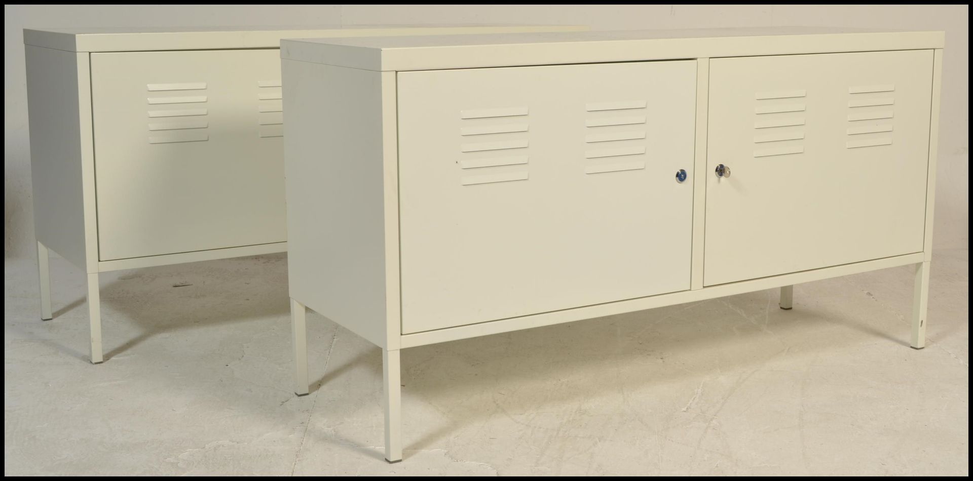 A pair of contemporary metal locker style  sideboard credenzas, each finished in a white colourway