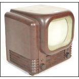 A Bush type TV22 Television Receiver, 1950, 405-line standard, 9-inch screen with white mask, in