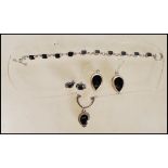 A stamped 925 silver demi parure jewellery set consisting of teardrop earrings, collar necklace