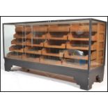 A good early 20th century Industrial painted oak shop haberdashery display counter. Raised on