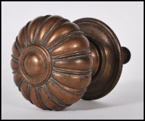 A 19th Century Victorian large bronzed door handle / pull. Gadrooned knop handle retaining