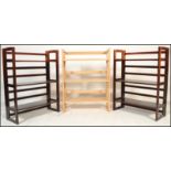 A pair of vintage style 20th Century wooden folding metamorphic bookcases / traders display shelves.