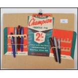 A 20th Century vintage retro Champion pens advertising shop display board having card pen holders