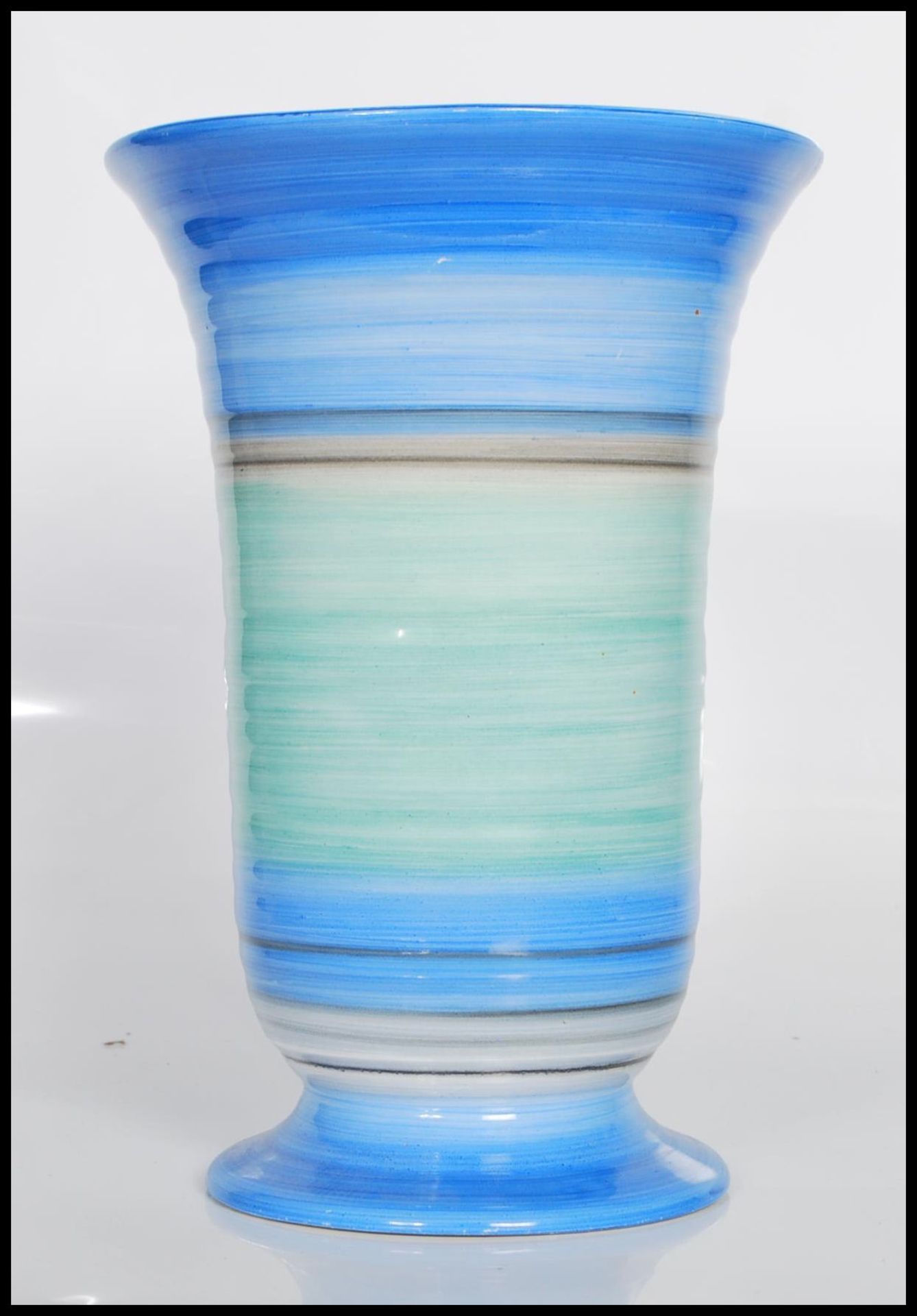 An early 20th Century Art Deco vase by Shelley. The ribbed vase decorated in pale blue, green to