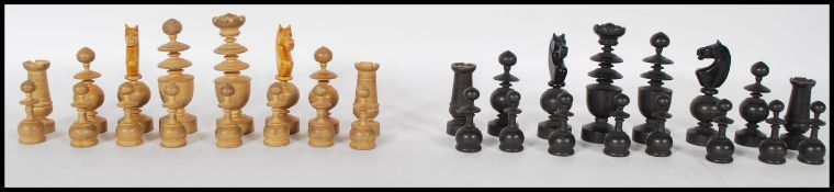 A vintage early 20th Century chess set having a complete set of boxwood and ebonised turned