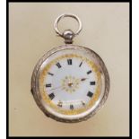 A 20th century continental silver fob pocket watch having a white enamelled face with gilt floral