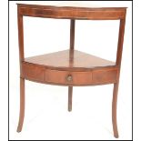 A Georgian mahogany inlaid  corner two tier wash stand, single drawert to lower tier raised on