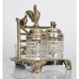 A 19th Century High Victorian silver plated and cut glass three piece table cruet set, the silver
