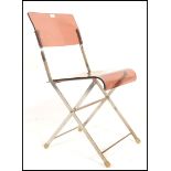 A retro mid 20th Century 1960's folding chair. The chair having a metal frame with a smoked brown