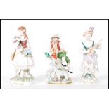 A group of three German continental porcelain figures dating from the early 20th Century to