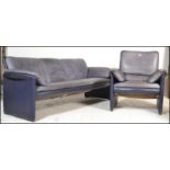 A 20th Century vintage Leolux lounge suite consisting of a three seater sofa and armchair , the body