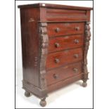 A 19th century Victorian Scottish mahogany chest of drawers having a central bank of four drawers