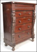 A 19th century Victorian Scottish mahogany chest of drawers having a central bank of four drawers