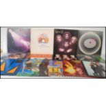 A collection of vinyl long play LP records together with some 12" vinyl single records dating to the
