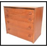 A vintage retro 20th Century Teak wood chest of four straight graduating drawers, the drawers fitted