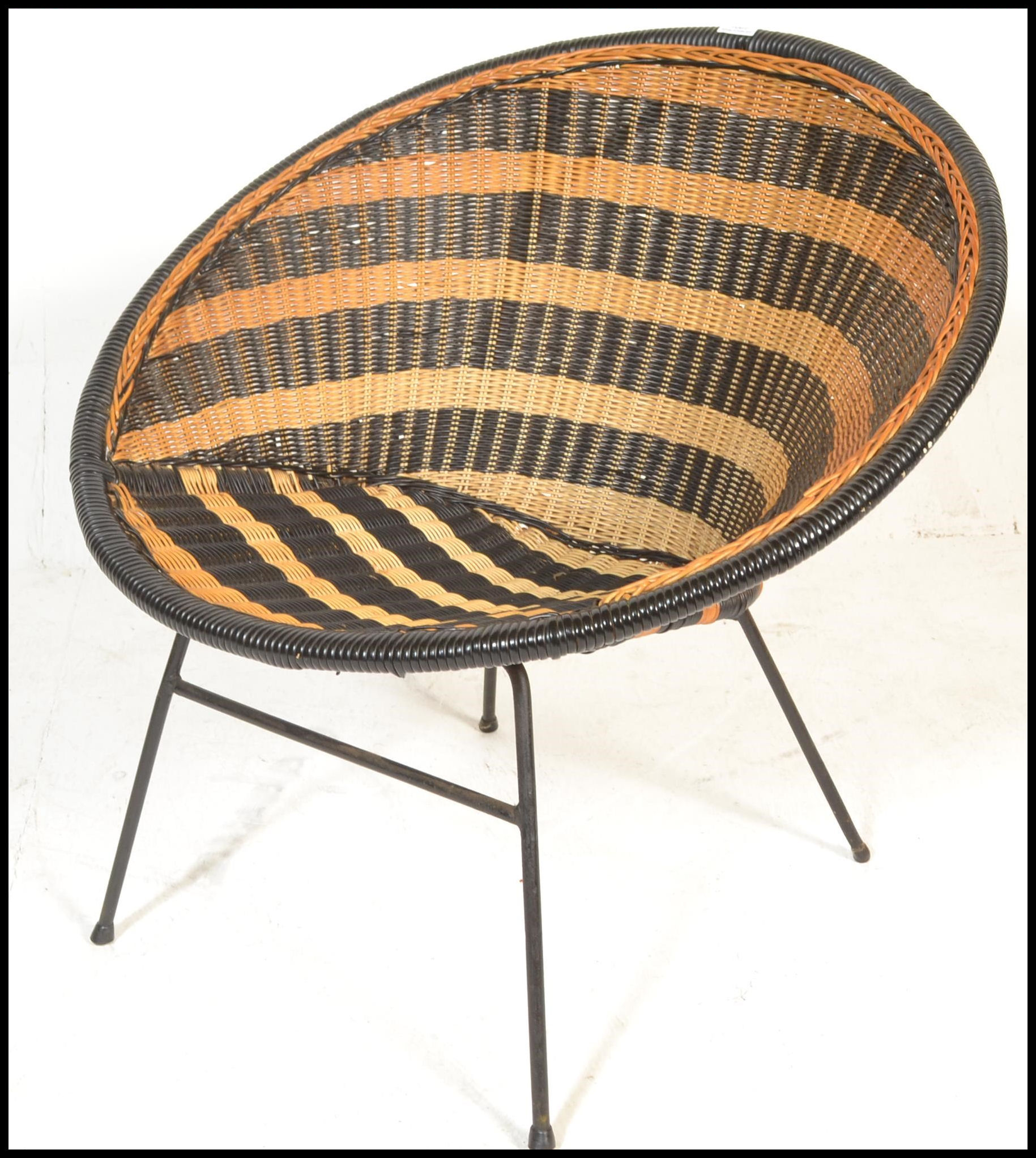 A mid century, circa 1950's satellite chair raised on tubular metal frame with two tone weave bucket