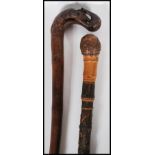 A 20th Century carved bamboo Japanese style walking stick cane decorated with carved blossoms and