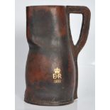 A vintage mid 20th Century commemorative leather blackjack drinking tankard / ewer jug having gilt