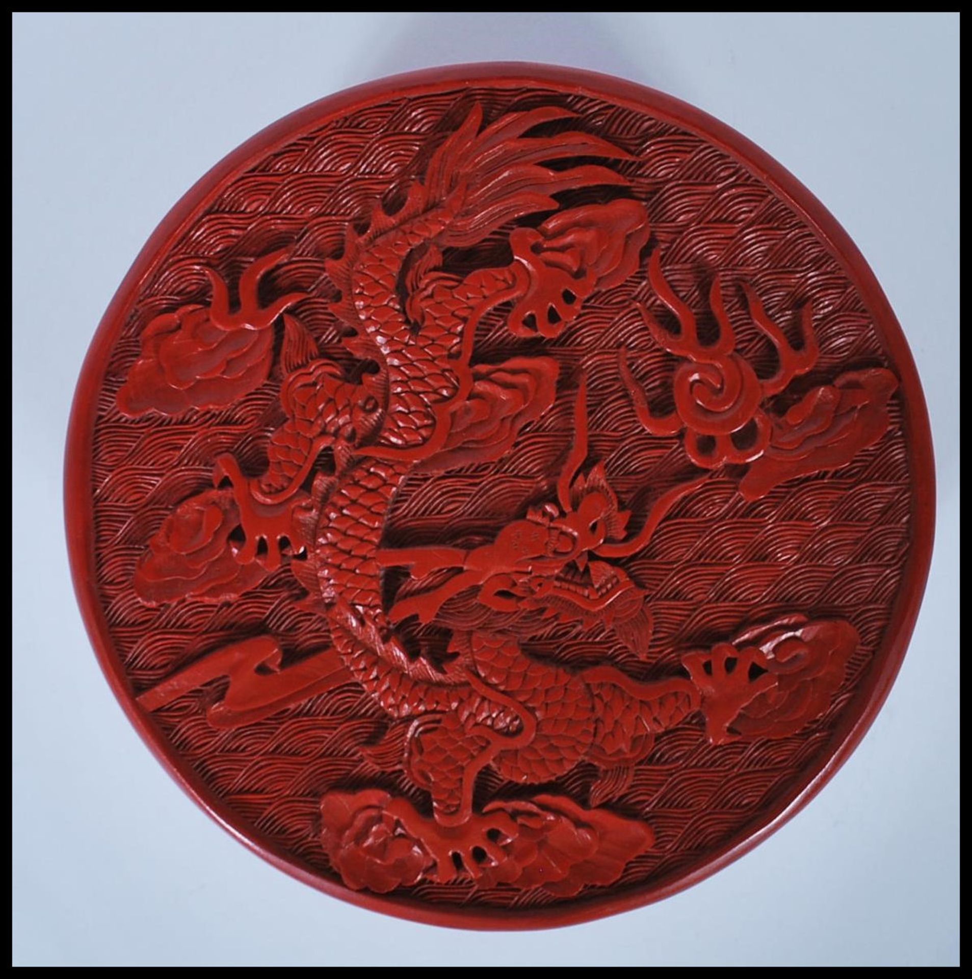 A 20th Century Chinese Cinnabar round desk top box of round form having carved relief of a Chinese - Image 5 of 7