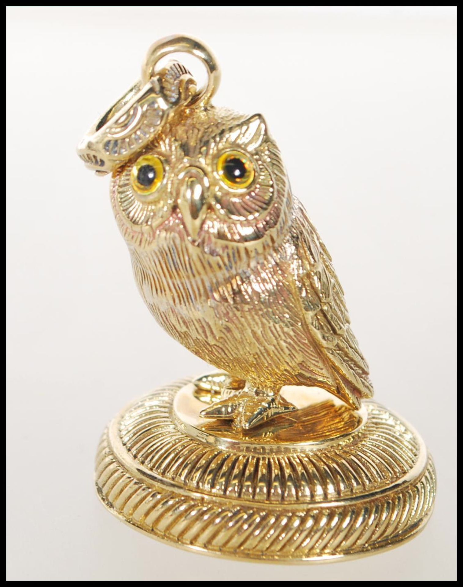 A contemporary gold plate seal in the form of an owl. Measures 4cm tall by 2.5cm diameter.