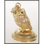 A contemporary gold plate seal in the form of an owl. Measures 4cm tall by 2.5cm diameter.