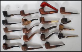 A good collection of vintage smoking tobacco pipes to include a leather case example having a