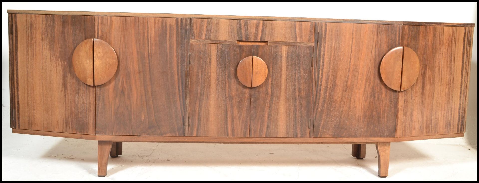 A retro mid century Danish Inspired crendenza sideboard. Raised on squared legs with a wide and deep