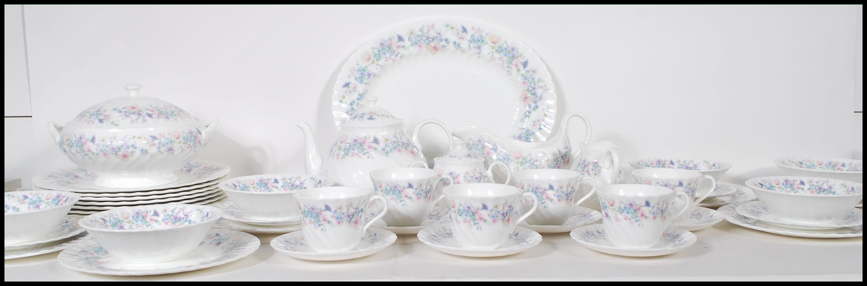 A vintage Wedgwood china tea / dinner service in the Angela pattern to include dinner plates, side