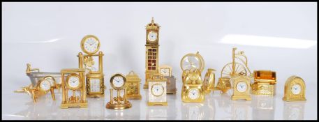 A collection of brass and yellow metal miniature novelty quartz clocks (mostly by William Widdop) to