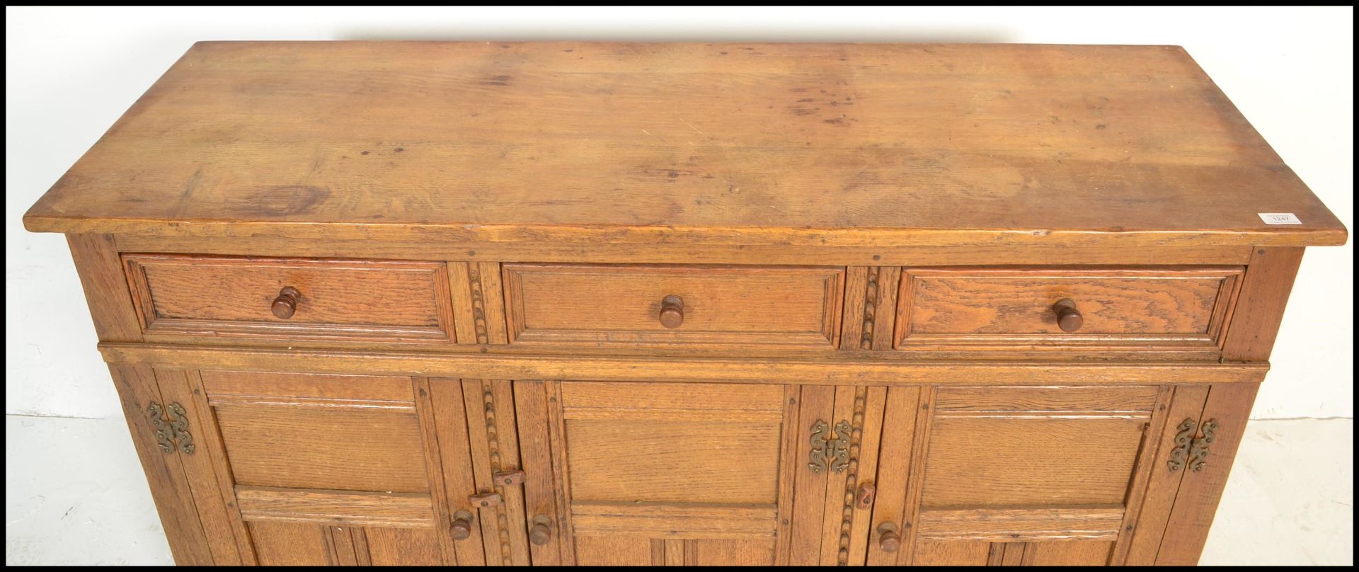 A 20th Century oak Jacobean revival sideboard credenza, flared top over a configuration of drawers - Image 6 of 6
