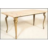 A vintage 20th century marble topped coffee table of rectangular form being raised on gilt antique