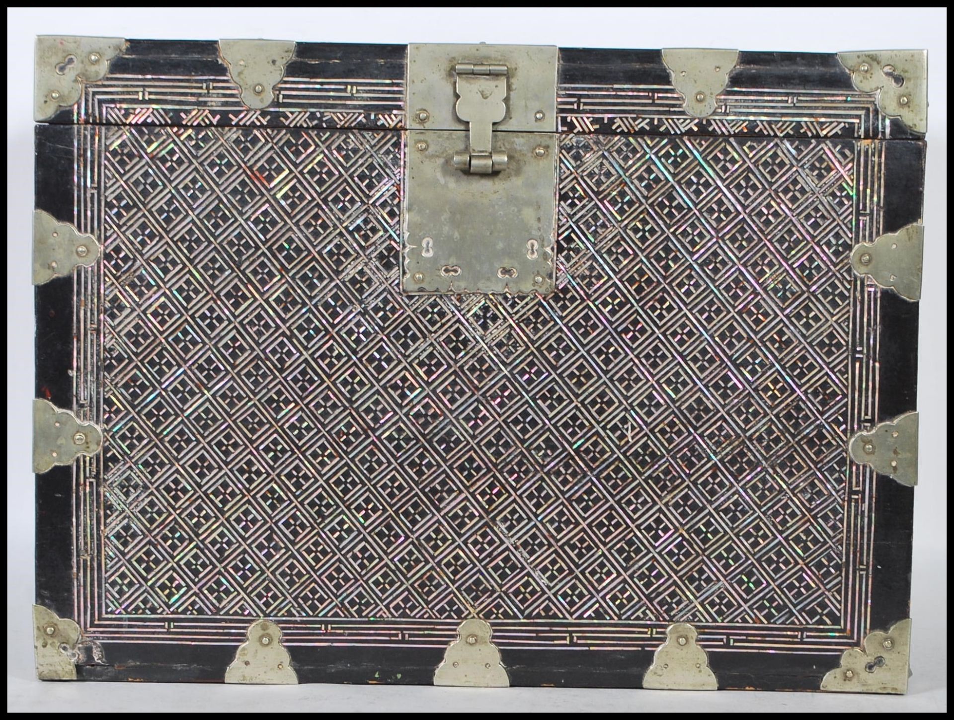 A Chinese Oriental ebonised wood lacquered chest box having mother of pearl inlay decoration in