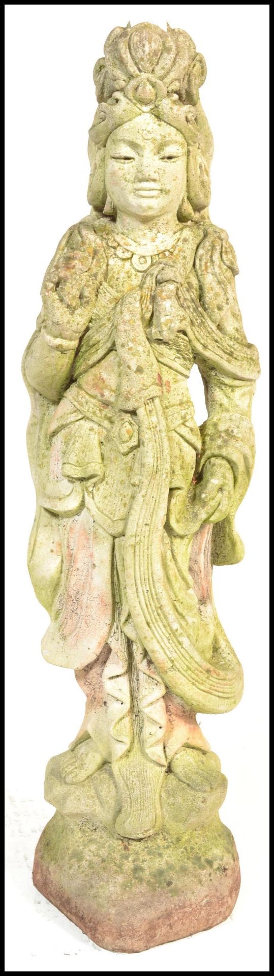 A 20th century Oriental South East Asian reconstituted stone garden statue ornament in the form of a