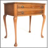 A 20th Century mahogany free standing cutlery canteen bow fronted side table being raised on four