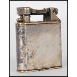 A 1930 / 40's Dunhill Art Deco silver plated lift arm petrol lighter of square form having rounded