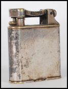 A 1930 / 40's Dunhill Art Deco silver plated lift arm petrol lighter of square form having rounded