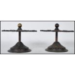 A matching pair of late 19th Century Victorian cast iron post office desktop stamp holder stands