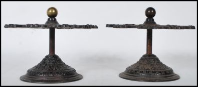 A matching pair of late 19th Century Victorian cast iron post office desktop stamp holder stands
