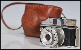 A rare vintage mid 20th Century 1950's Japanese super miniature Hit spy camera complete in leather