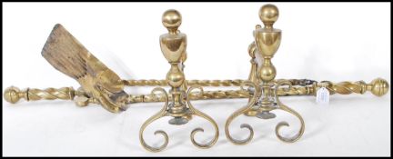 A pair of 19th century brass candy twist fireside companions to include a pair of tongs and