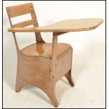 A vintage 20th Century school chair desk, the chair constructed from metal, raised on shaped