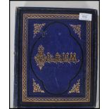 A 19th century Victorian album having blue boards with gilt tooling. The album comprising decoupage,