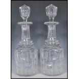 A matching pair of 19th Century Victorian cut glass decanters. Each one having hollow blown