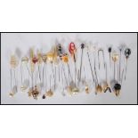 An assortment of vintage 20th Century hat pins to include a Scottish thistle finial hat pin,